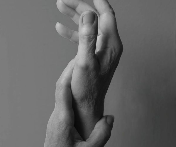 Abstract image of a brain connected to a heart, symbolizing mind-body connection.