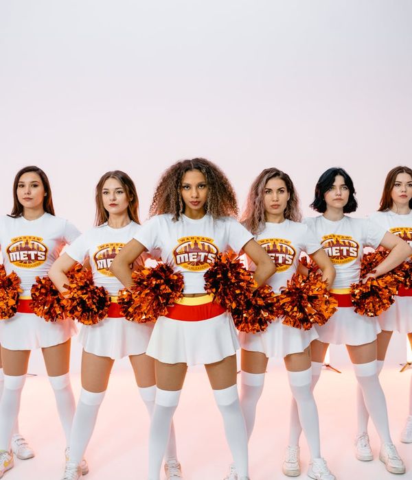 Diverse group of people smiling and looking energetic.