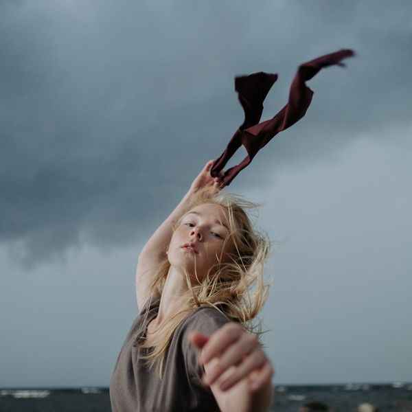 Person in a dynamic pose, embodying energy and movement.